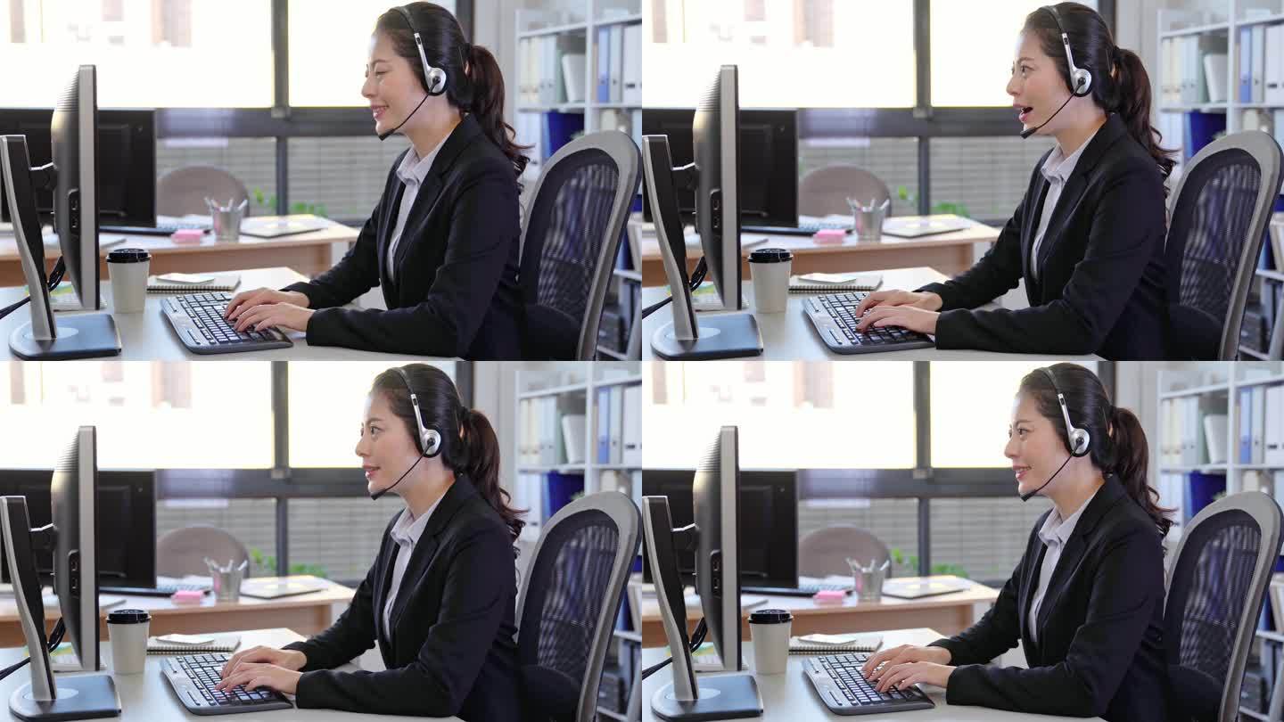 呼叫中心商务女士用耳机说话。亚洲女性在客户服务岗位上通话.