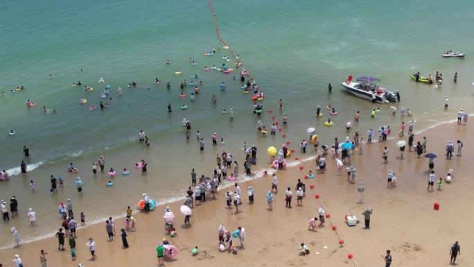 4k海岛沙滩风力发电航拍