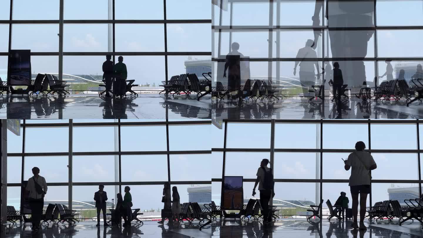 玻璃幕墙人物人群逆光剪影机场登机商务会见