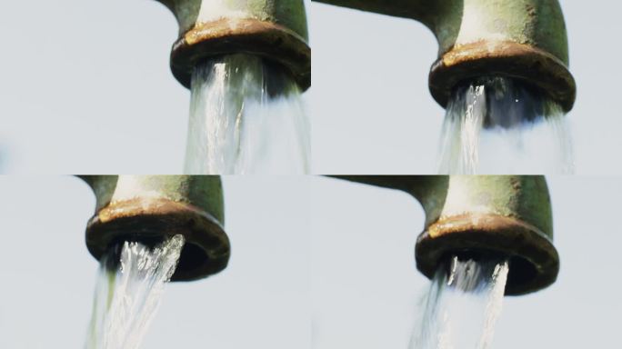 从泵里流出的干净饮用水的特写