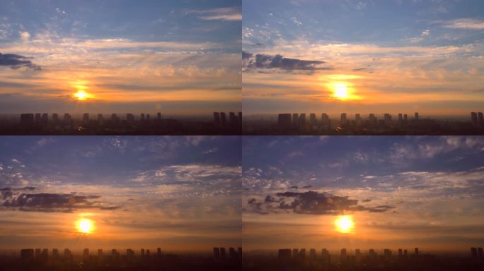 日出东方朝霞城市天际线太阳穿过云层