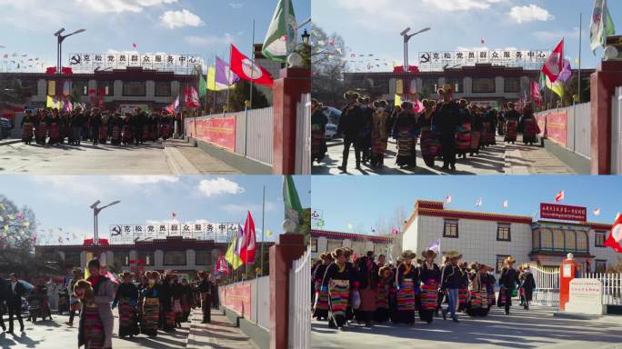 一群穿民族服饰的藏族同胞迎面走来