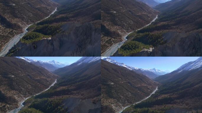 空中鸟瞰喜马拉雅山脉，山谷在阳光明媚的夏日与新鲜的河流。雄伟壮丽的景观尼泊尔河流峡谷和山峰