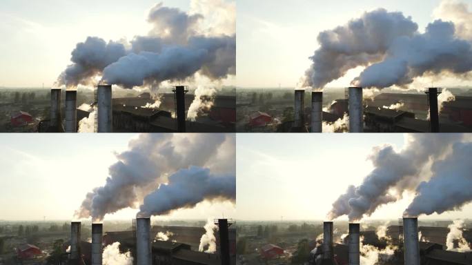 在清晨美丽的阳光下，管道向天空喷射烟雾的特写镜头