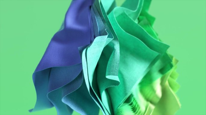 时尚的概念。抽象的背景与飘动的帷幔，飞行折叠的方形块织物。绿蓝色