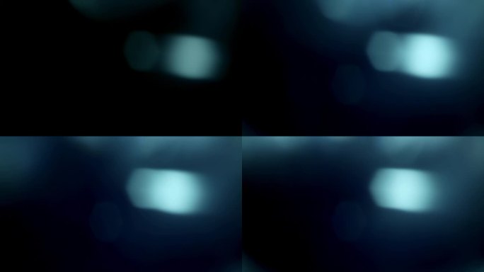 蓝光泄漏与多重六边形散景，镜头光晕覆盖效果在黑色背景。