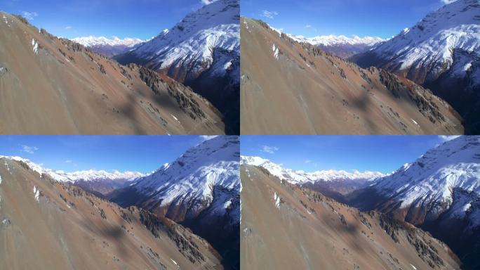 上升鸟瞰图喜马拉雅山脉与雪峰在阳光明媚的夏日。雄伟壮丽的尼泊尔风景在路线上提利科大本营。安纳普尔纳环