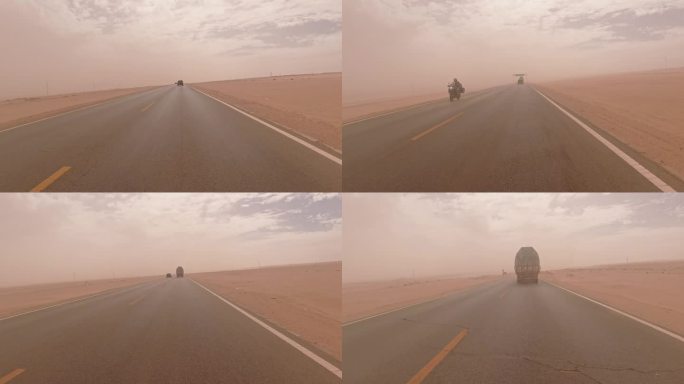 沙尘暴戈壁沙漠公路上行驶的汽车