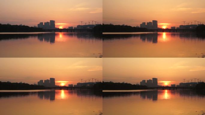 河边日出早晨黎明水天一色太阳照在水面上