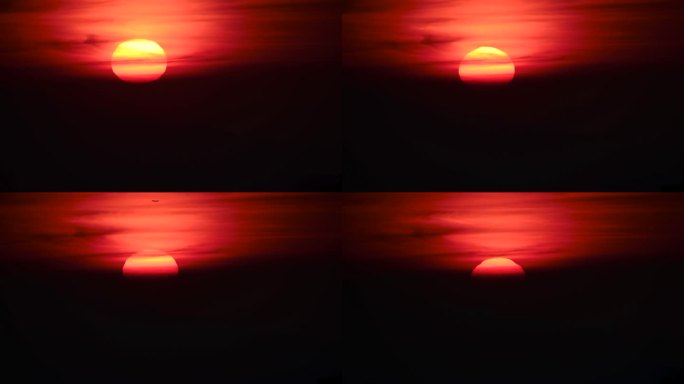橘红色的晚霞在向地平线移动的过程中被云层所覆盖。