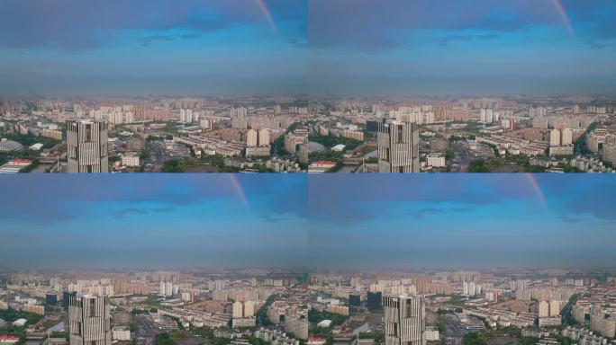 4K航拍雨后出现彩虹的城市风光