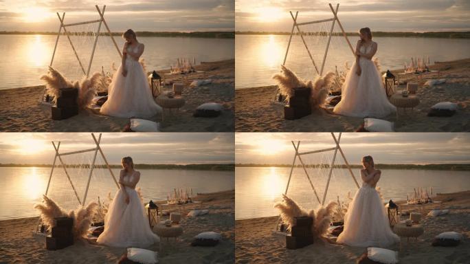 美丽温柔的新娘，穿着婚纱，独自站在夕阳下的湖岸