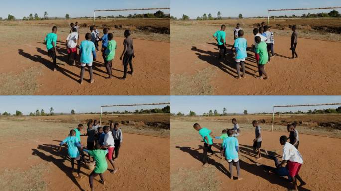 贫困。贫穷的非洲黑人儿童在城镇贫民窟踢足球