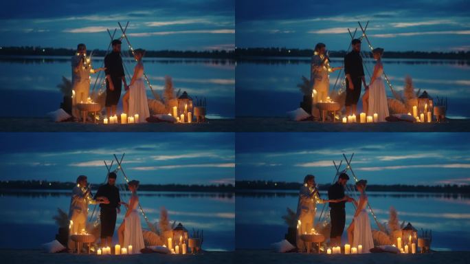 日落后湖边浪漫的婚礼，新娘和新郎的剪影