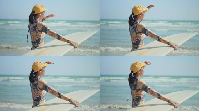 在阳光明媚的海滩上，女冲浪者用冲浪板遮住自己的手