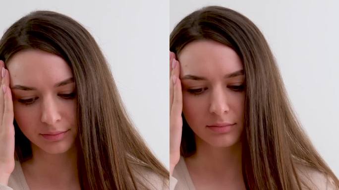 环境问题影响人们的健康头痛女孩抱头拉直她的头发疲劳需要在白色的背景上休息药丸药物坏的空气坏的大气辐射