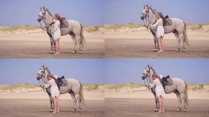 穿白衣的女孩抱着她的马
