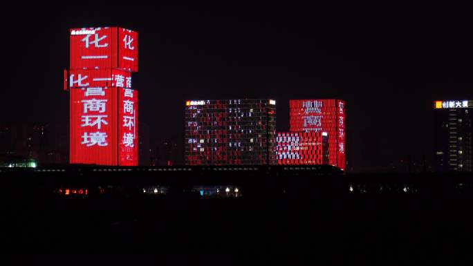 行驶中的高铁穿越西咸大厦城市夜景