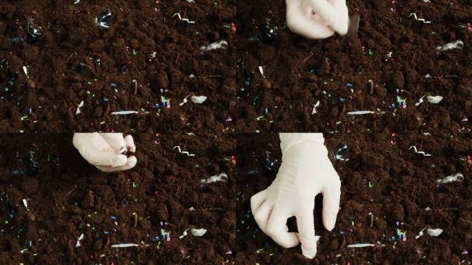 微塑料污染地球，土壤中的塑料颗粒特写，清理地面垃圾和垃圾，环境生态问题。全球变暖和气候变化。