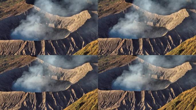 航拍无人机拍摄的日出场景，火山喷发的烟雾被云雾包围。Bromo, sememeru, Batok和W