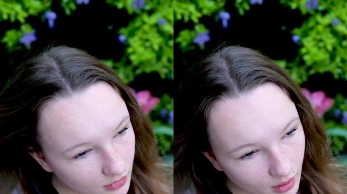 美丽的年轻女孩女子少年调整她的头发在夏天蝴蝶形状的灌木背景丁香衣服温柔的化妆女性自然美童贞温柔垂直视