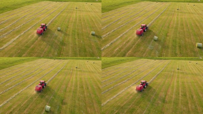 农民在拖拉机上用拖车圆形打包机从草地上收集干草，用于日落地里的饲料收获