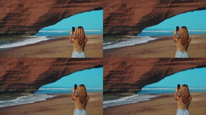 一名女子在海滩上用手机捕捉到令人惊叹的岩层