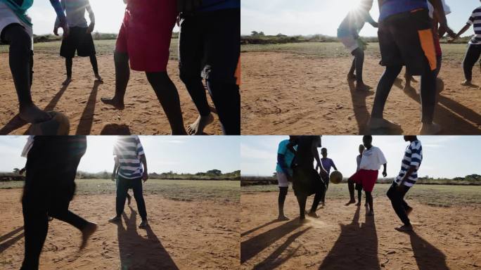 贫困。裁剪的观点。贫穷的非洲黑人儿童在城镇贫民窟踢足球