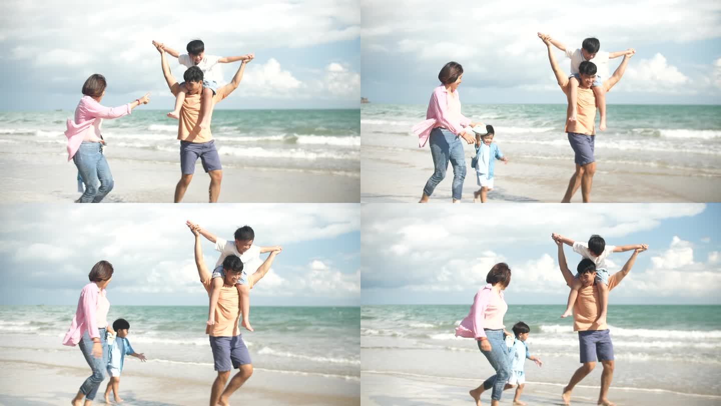 一个亚洲家庭在海滩上散步，心情愉快