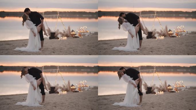 夕阳下，多民族情侣在沙滩上热烈拥抱亲吻，浪漫的新婚夫妇