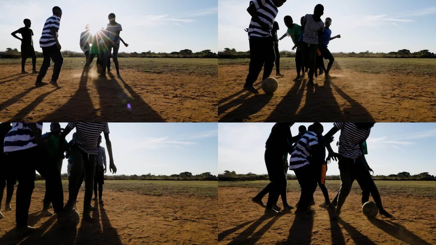 贫困。缓慢的运动。贫穷的非洲黑人儿童在城镇贫民窟踢足球
