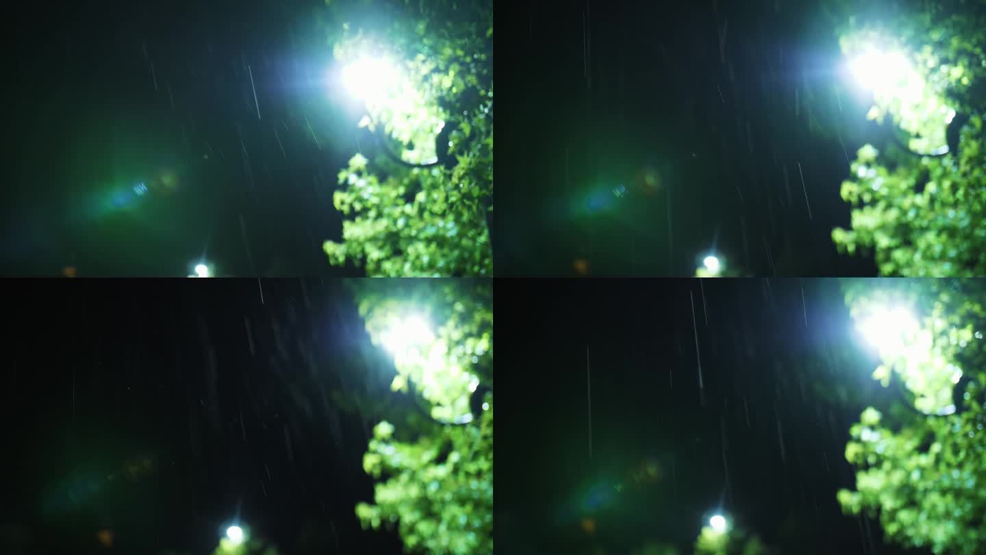 路灯。雨下降。夜里下雨了。光雨。水坑与灯光反射在城市人行道上。路灯。雨滴与路灯。特写镜头。