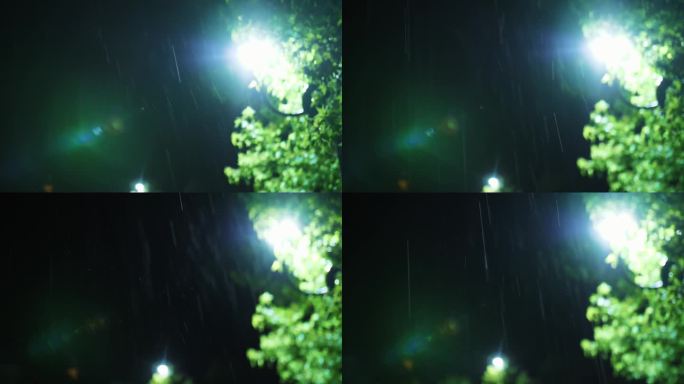路灯。雨下降。夜里下雨了。光雨。水坑与灯光反射在城市人行道上。路灯。雨滴与路灯。特写镜头。