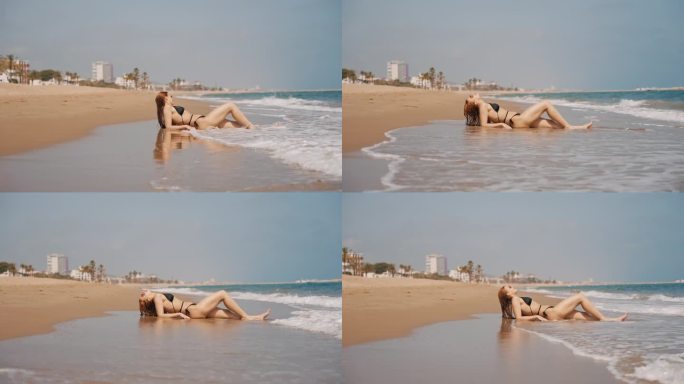 暑假，比基尼女郎在沙滩上放松