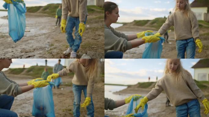 可爱的小女孩清理湖岸的塑料垃圾，帮助她的母亲志愿者