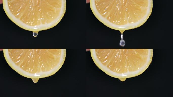 美味多汁的柠檬，一滴水或果汁流下一片柠檬在黑暗的背景，特写