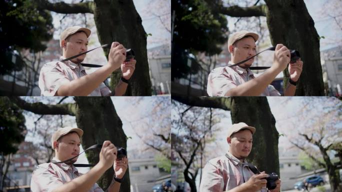 一名亚洲年轻人在东京游览，沉浸在周围的大自然中。,寻找快乐