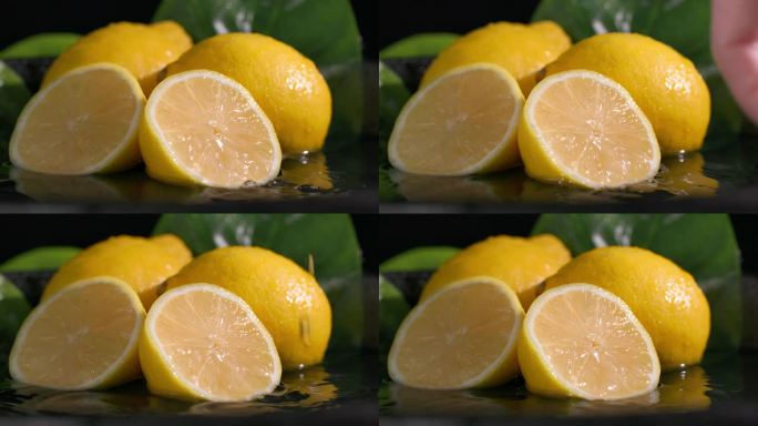 成熟的柠檬片落在躺在水里的柑橘上，黑色的背景，水花散落在不同的方向，特写