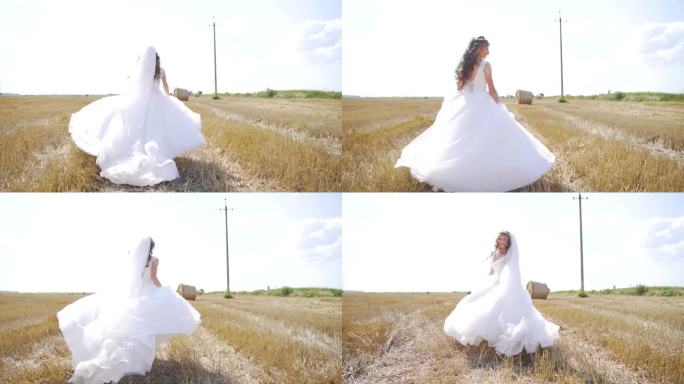 快乐的年轻女子穿着白色的裙子在麦田里奔跑。慢动作