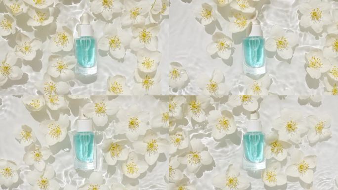 化妆品瓶、瓶和茉莉花花瓣在水面上滴着。纯净的水反射阳光和阴影。缓慢运动的海浪。设计、广告、产品