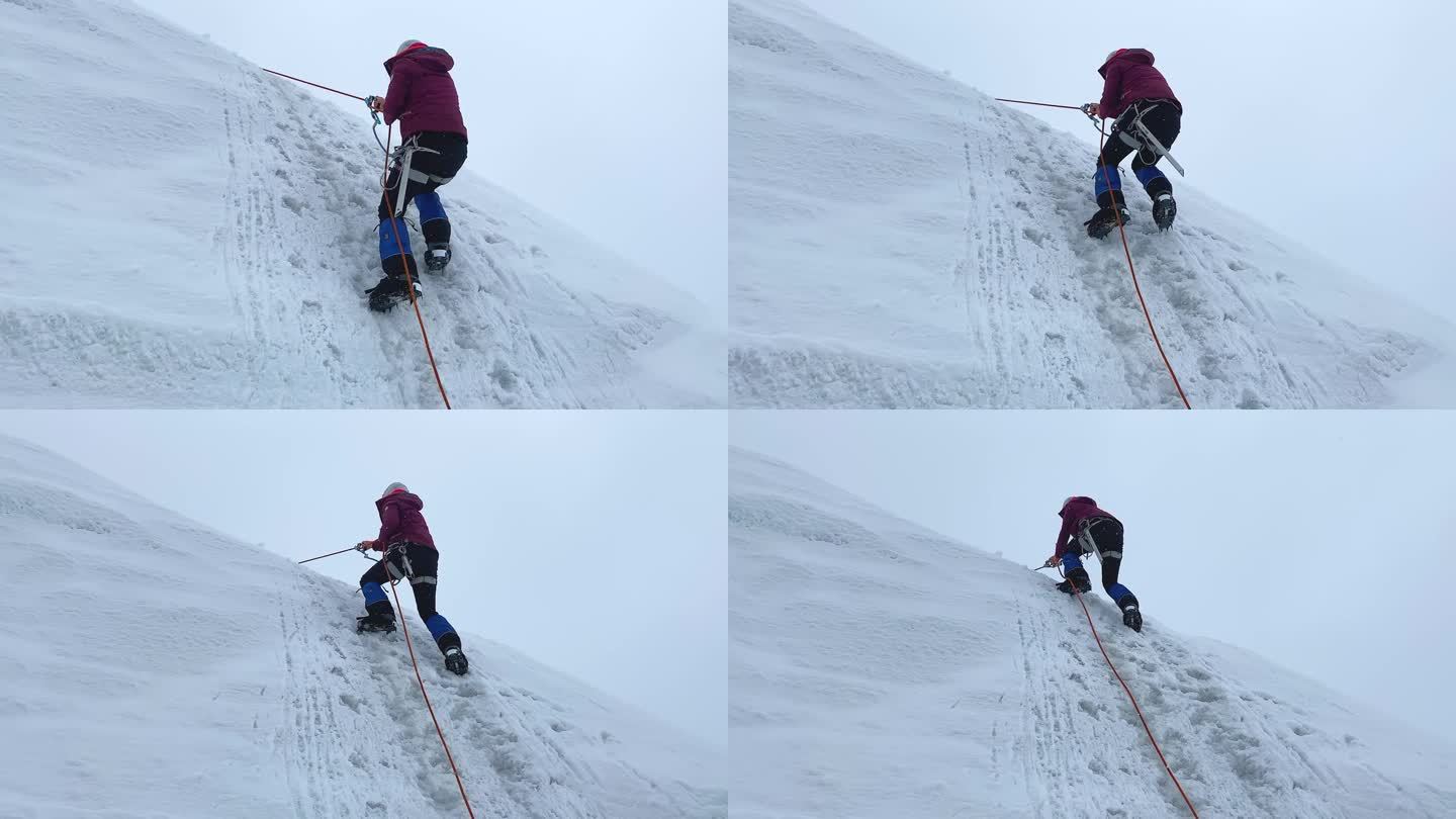一名女登山者在垂直栏杆上的竹马的帮助下爬上陡峭的冰雪斜坡。