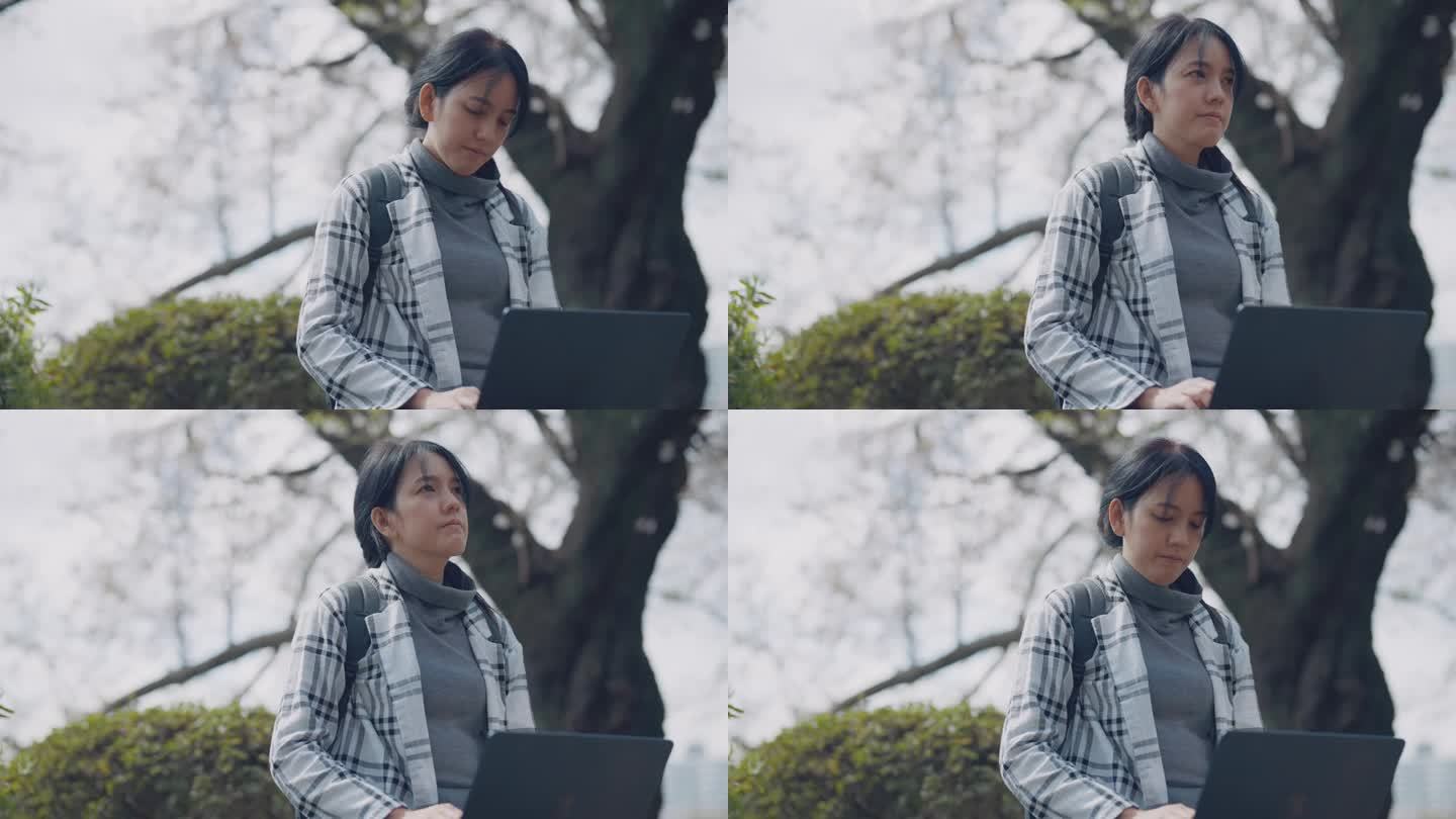 年轻女子一边在笔记本电脑前工作，一边在大自然中放松。她正在为一个新项目构思构思。