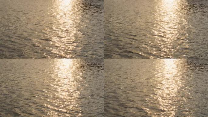 黄昏时粼粼的阳光照在水面上