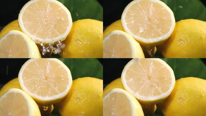 异国情调的柑橘类水果，多汁的柠檬在黑暗的背景上加水，特写