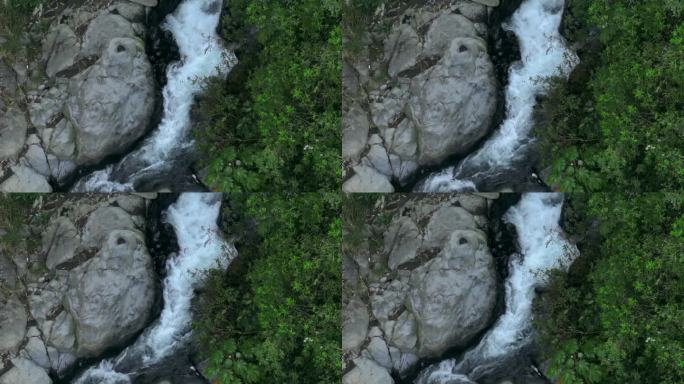 空中无人机拍摄的日出景象，热水从古农克卢德和蓝色火山口的岩石中落下，克卢德火山，Kediri，东爪哇