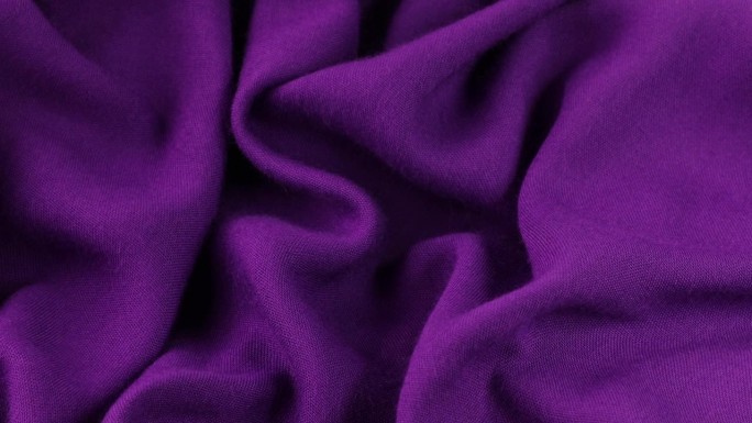 紫色织物背景。紫色布料波浪背景纹理。紫色织物布料纺织材料。