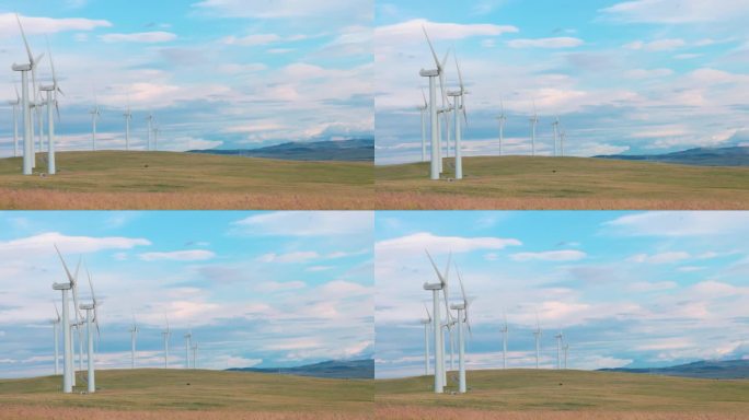 风力涡轮机、草原和远山的美景