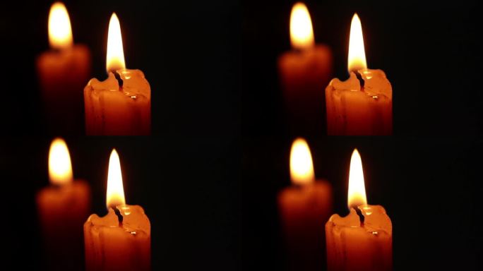 烛光和黑暗中蜡烛在镜子中的反射