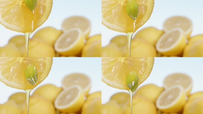 蜂蜜顺着柠檬片流下来，薄荷叶掉下来。特写镜头。
