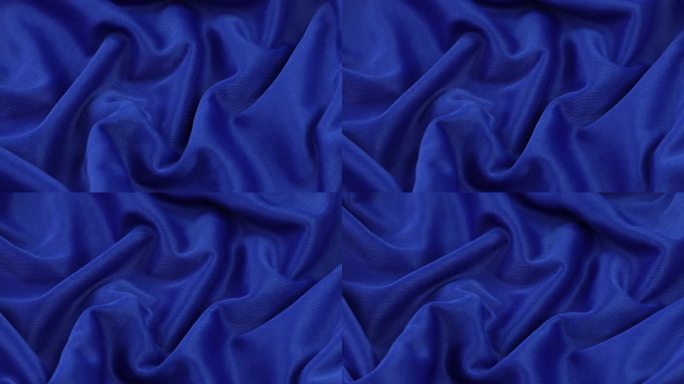蓝色织物背景。蓝色布料波浪背景纹理。蓝色织物是纺织材料。